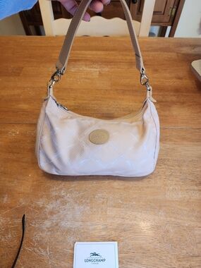 beige nylon Longchamp hobo shoulder bag with a monogram print and leather trim.